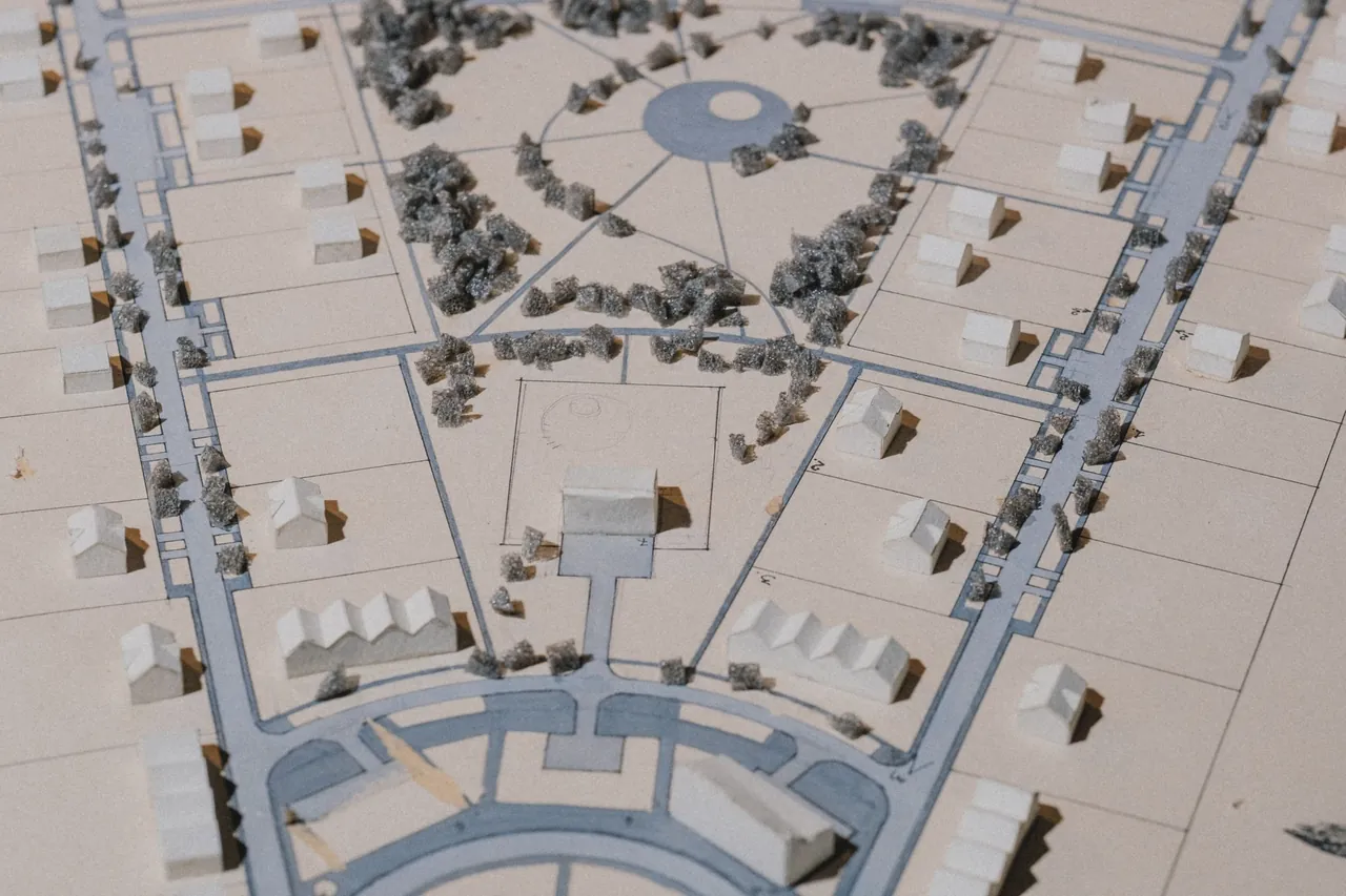 An architectural model of a neighborhood plan with streets, lots and houses